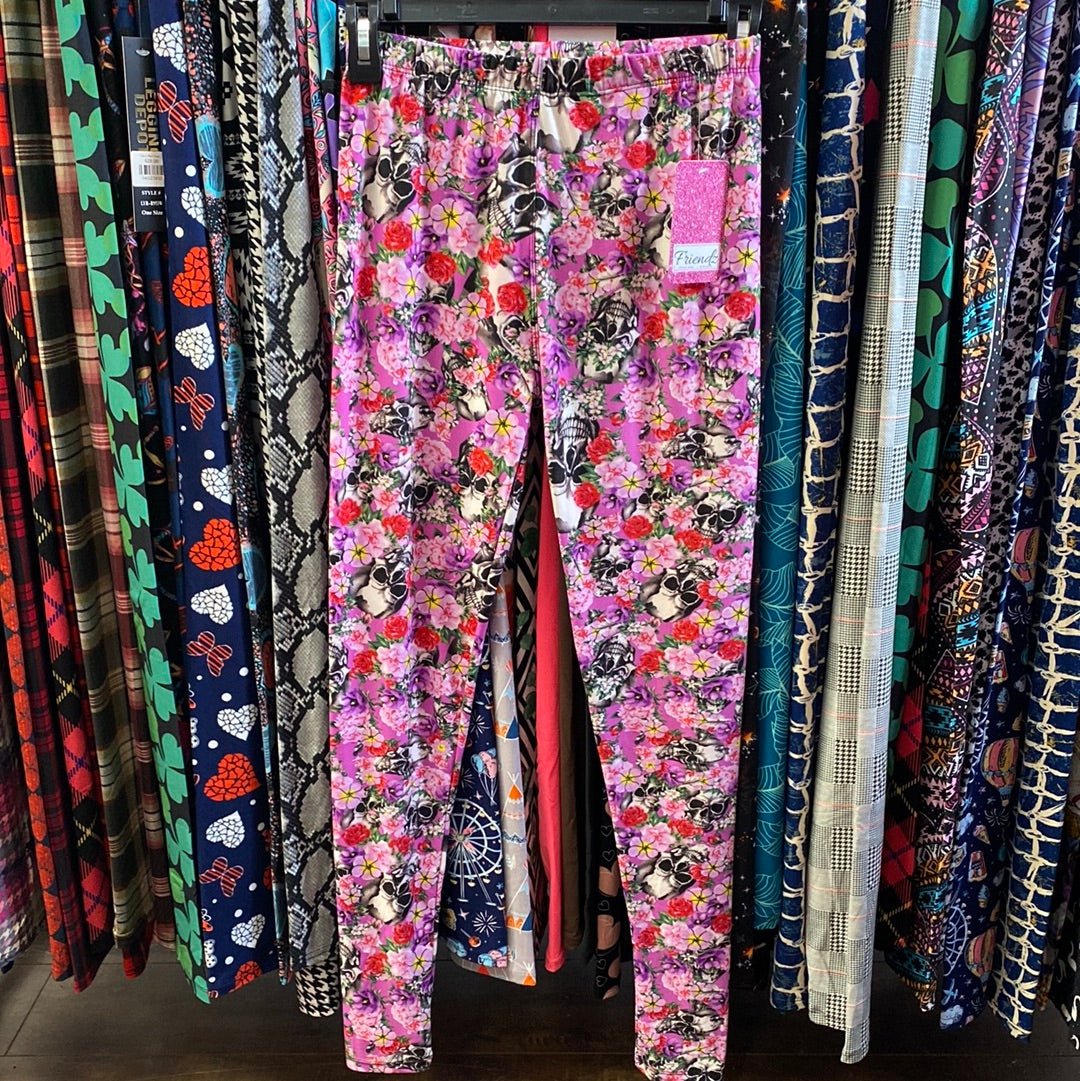 Leggings rosas con estampado floral de calaveras