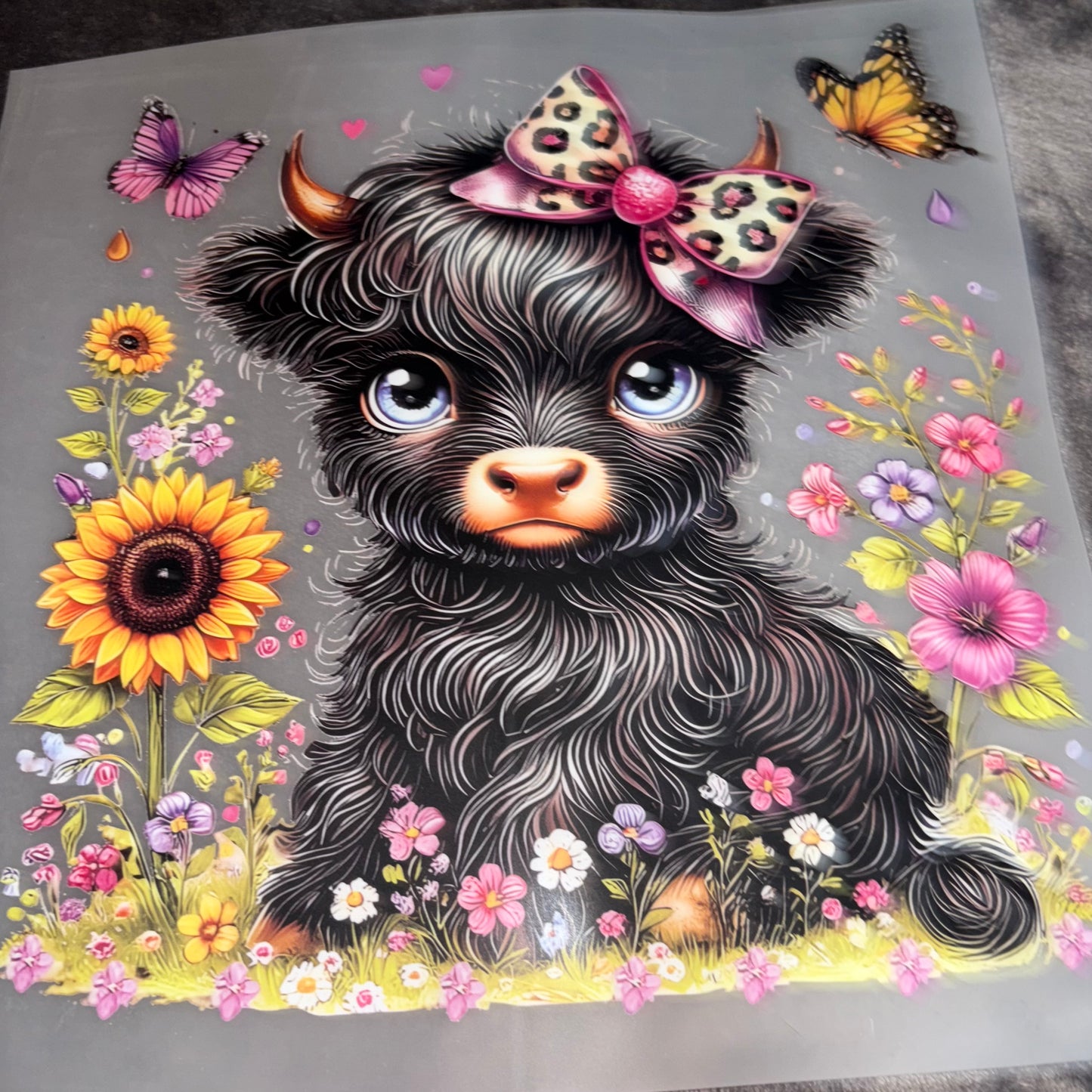 Black Cow with Bow in Feild of flowers and Butterflies Shirt Transfer