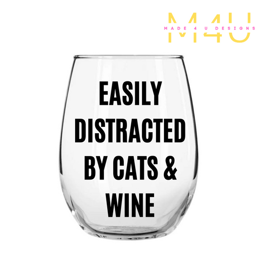 Easily distracted by cats and wine glass